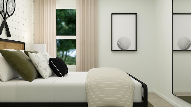 bedroom with carpet and baseboards