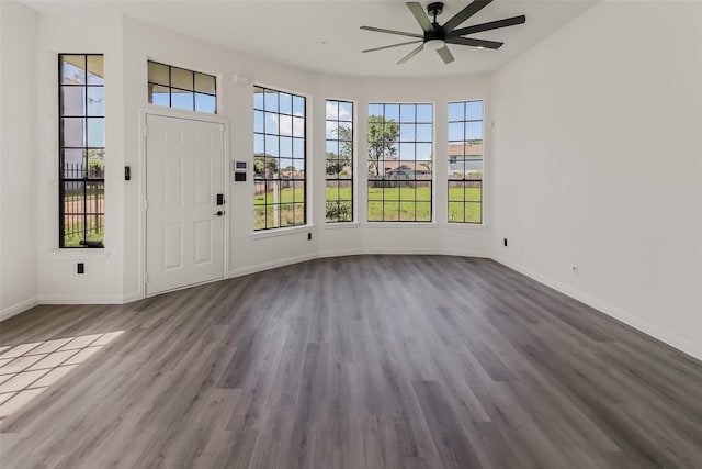 8888 Benning Dr Unit 313, Houston, TX 77031 - doorway to outside featuring ceiling fan, dark wood finished floors, and baseboards