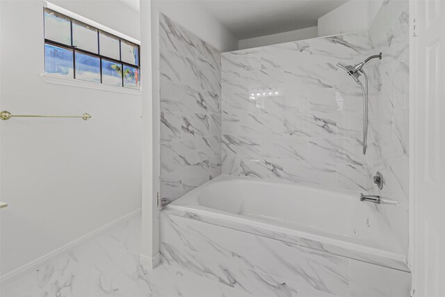 8888 Benning Dr Unit 313, Houston, TX 77031 - bathroom with marble finish floors, baseboards, and a combined bath / shower with marble appearance
