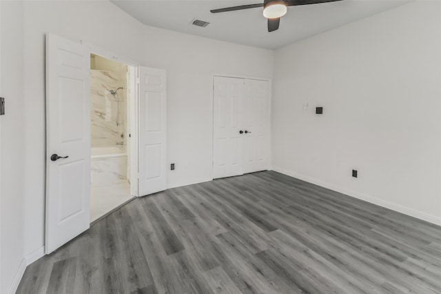 8888 Benning Dr Unit 313, Houston, TX 77031 - unfurnished bedroom with wood finished floors, baseboards, a ceiling fan, and ensuite bath