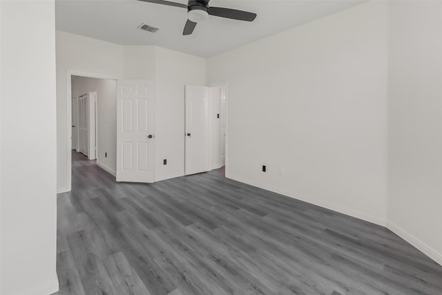 8888 Benning Dr Unit 313, Houston, TX 77031 - unfurnished bedroom with dark wood-style floors, baseboards, and ceiling fan