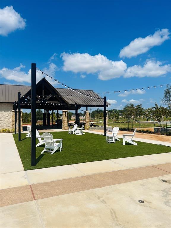 surrounding community with a gazebo and a lawn
