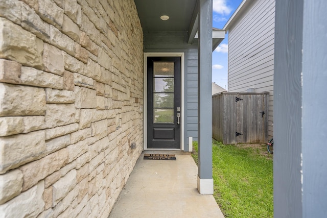 entrance to property with stone siding
