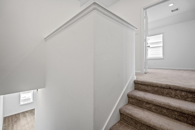 stairs featuring baseboards