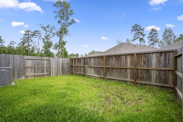 view of yard featuring central AC