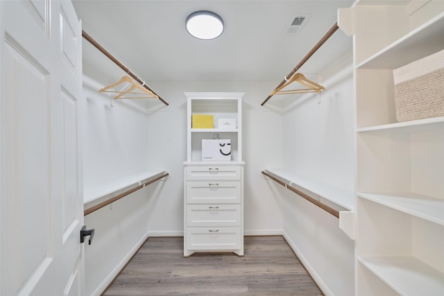 walk in closet featuring light wood finished floors