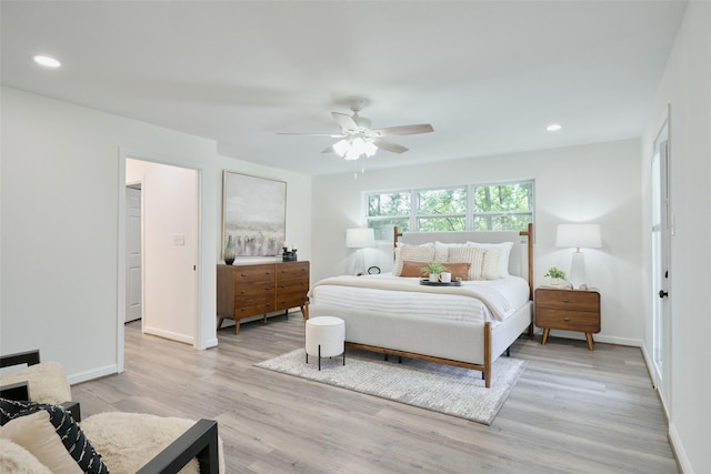 bedroom featuring light wood-type flooring, baseboards, recessed lighting, and ceiling fan