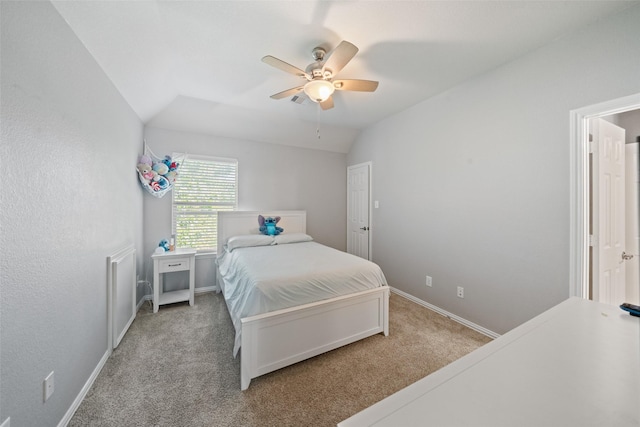 carpeted bedroom featuring baseboards, a ceiling fan, and vaulted ceiling