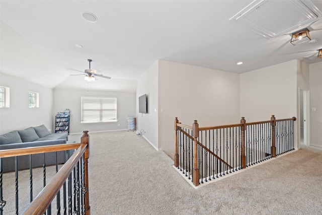 hall with attic access, carpet flooring, an upstairs landing, baseboards, and recessed lighting