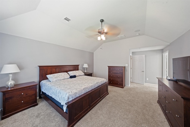 bedroom with vaulted ceiling, light colored carpet, ceiling fan, and baseboards