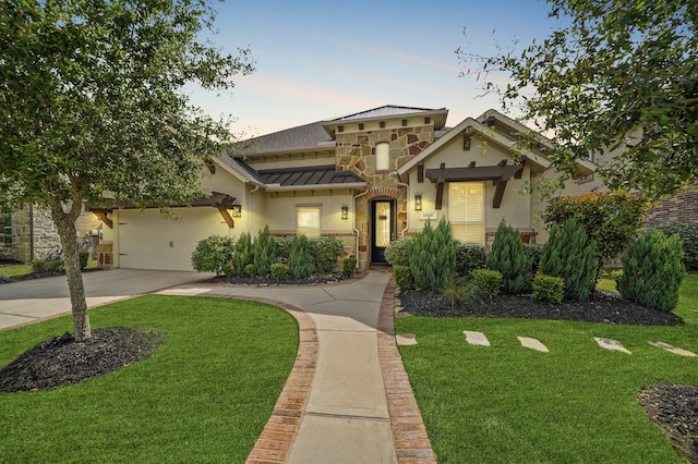 6519 Elrington Heights Ln, Katy, TX 77493 - mediterranean / spanish-style house with stone siding, a standing seam roof, driveway, and a lawn
