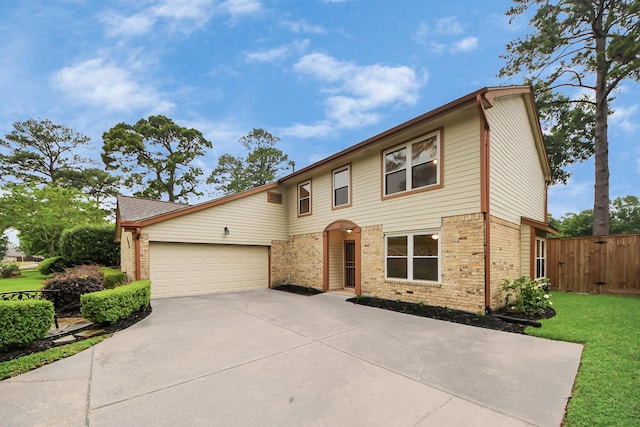 view of front of property with brick siding, an attached garage, and driveway