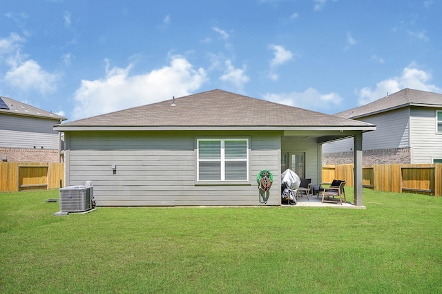 10707 Lost Maples Dr, Cleveland, TX 77328 - rear view of house with central air condition unit, a patio area, and roof with shingles