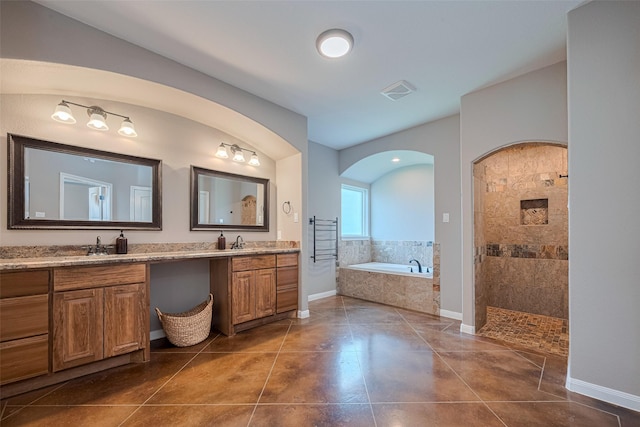 503 Weisinger Dr, Magnolia, TX 77354 - bathroom featuring a garden tub, tile patterned flooring, walk in shower, and double vanity