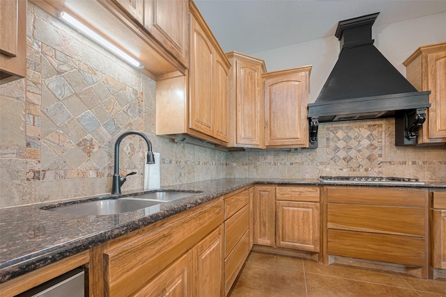 503 Weisinger Dr, Magnolia, TX 77354 - kitchen featuring custom range hood, a sink, stainless steel gas stovetop, and backsplash