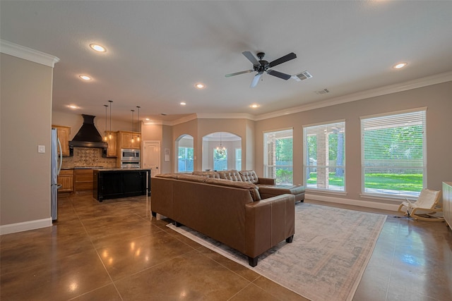 503 Weisinger Dr, Magnolia, TX 77354 - tiled living room with recessed lighting, crown molding, ceiling fan, and baseboards