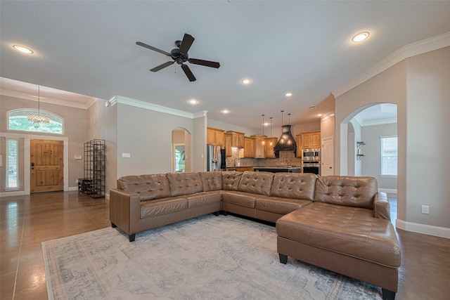 503 Weisinger Dr, Magnolia, TX 77354 - living area with arched walkways, ornamental molding, baseboards, a ceiling fan, and recessed lighting