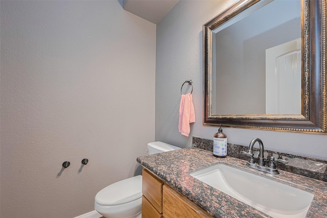 503 Weisinger Dr, Magnolia, TX 77354 - bathroom featuring toilet, vanity, and a textured wall
