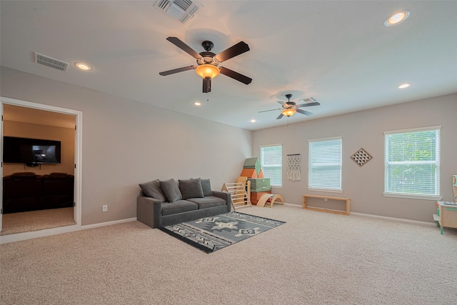 503 Weisinger Dr, Magnolia, TX 77354 - carpeted living area featuring plenty of natural light, a ceiling fan, baseboards, and recessed lighting