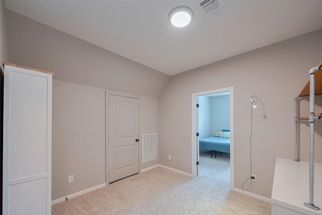 503 Weisinger Dr, Magnolia, TX 77354 - unfurnished bedroom with light colored carpet, baseboards, and vaulted ceiling