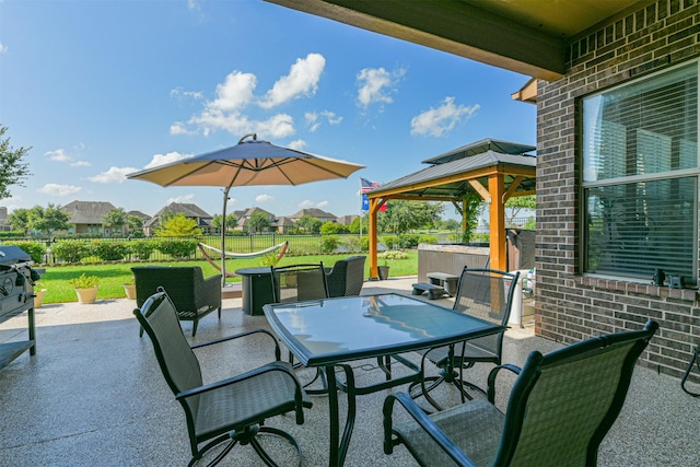 23615 Dolci Ln, Richmond, TX 77406 - view of patio featuring a gazebo, outdoor dining space, and a residential view