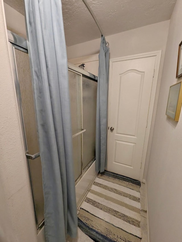 bathroom featuring enclosed tub / shower combo
