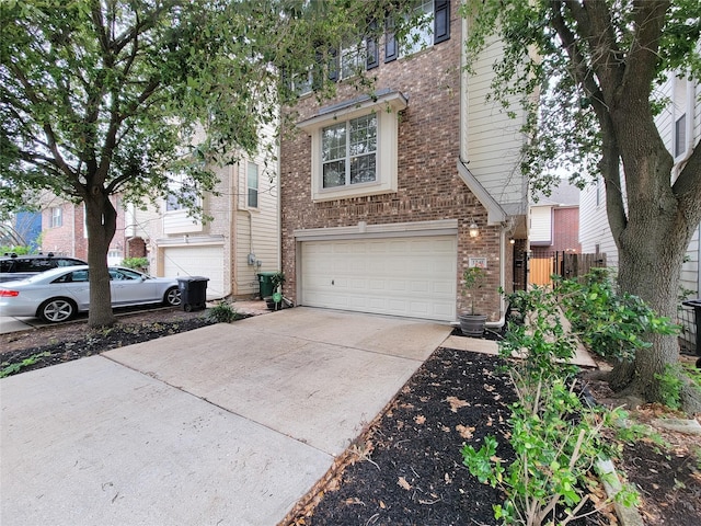 1241 Prince St, Houston, TX 77008 - view of front of home with brick siding, a garage, and concrete driveway