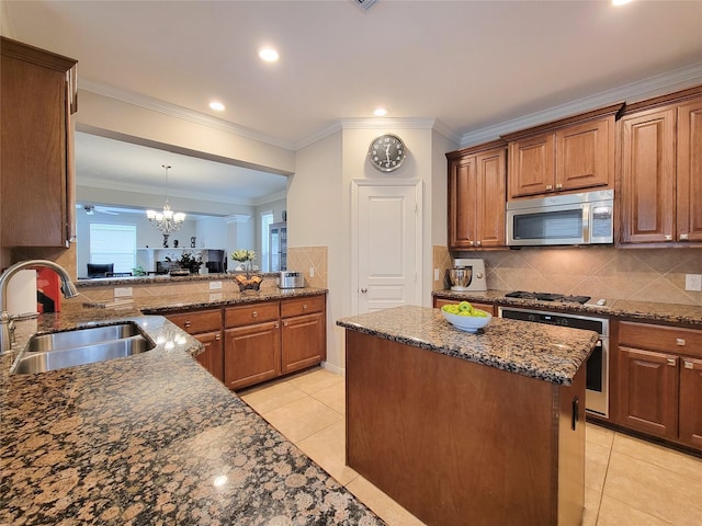 1241 Prince St, Houston, TX 77008 - kitchen with appliances with stainless steel finishes, a sink, a chandelier, light tile patterned floors, and dark stone counters