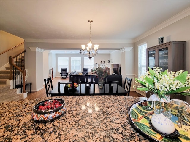 1241 Prince St, Houston, TX 77008 - dining room featuring a chandelier, stairs, ornamental molding, wood finished floors, and plenty of natural light