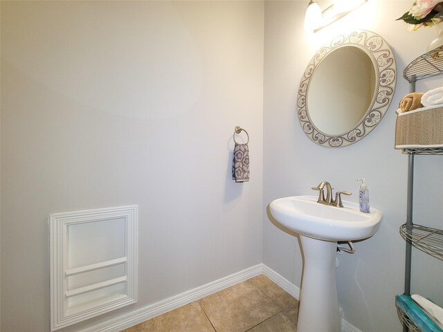 1241 Prince St, Houston, TX 77008 - bathroom with baseboards and tile patterned floors
