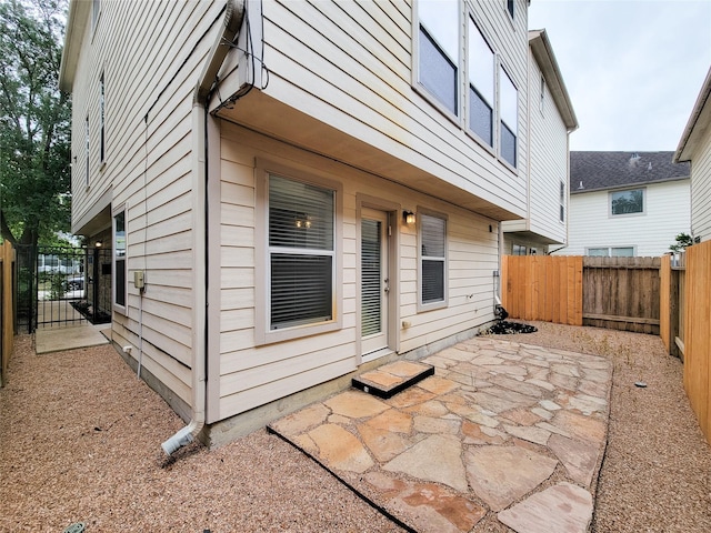 1241 Prince St, Houston, TX 77008 - fenced backyard featuring a patio and a gate