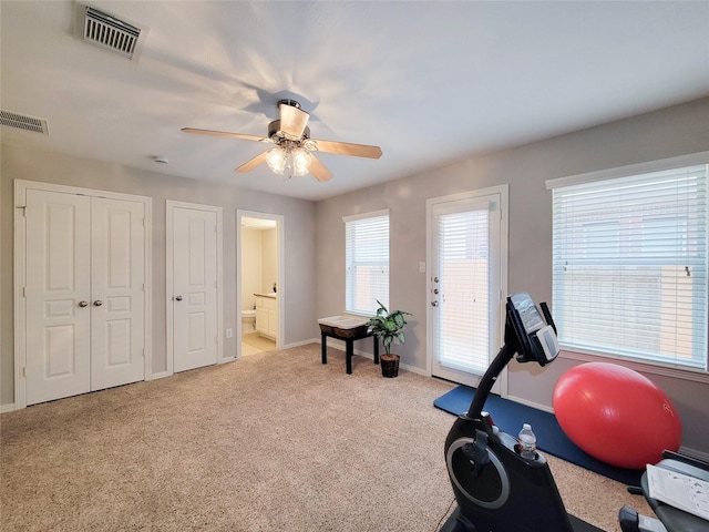 1241 Prince St, Houston, TX 77008 - workout room featuring light colored carpet, a ceiling fan, and baseboards