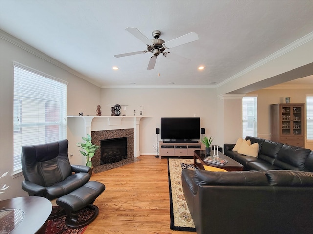 1241 Prince St, Houston, TX 77008 - living area with light wood-style floors, ceiling fan, healthy amount of natural light, a fireplace with flush hearth, and recessed lighting