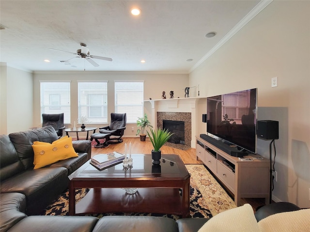 1241 Prince St, Houston, TX 77008 - living area featuring light wood-type flooring, a ceiling fan, ornamental molding, a fireplace with flush hearth, and recessed lighting