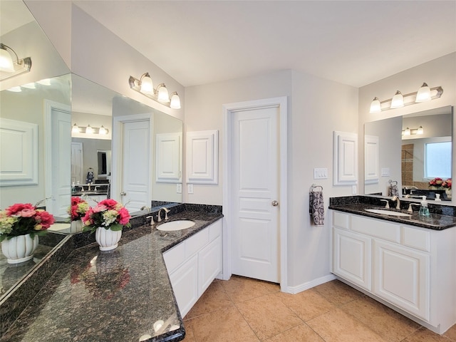 1241 Prince St, Houston, TX 77008 - bathroom with baseboards, two vanities, and tile patterned floors