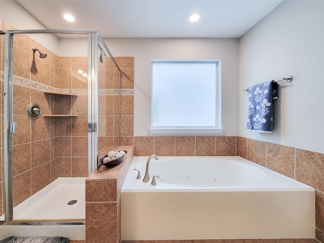 1241 Prince St, Houston, TX 77008 - bathroom with a tub with jets, a shower stall, and recessed lighting