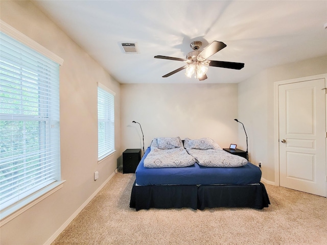 1241 Prince St, Houston, TX 77008 - carpeted bedroom with baseboards and ceiling fan