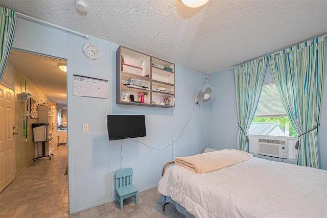 333 9th St, San Leon, TX 77539 - bedroom with a textured ceiling and cooling unit
