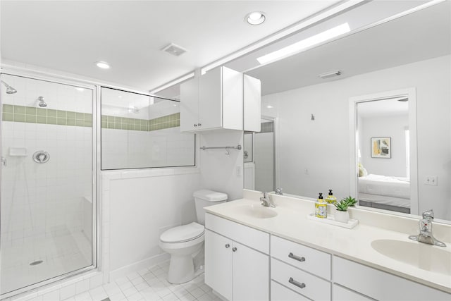 ensuite bathroom featuring a shower stall, toilet, tile patterned flooring, double vanity, and recessed lighting