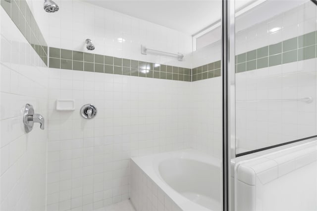 bathroom with a tile shower