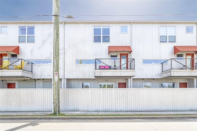 view of building exterior featuring fence