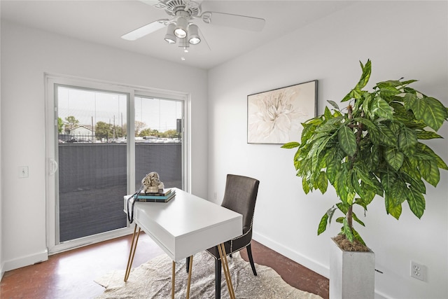 home office featuring baseboards and ceiling fan