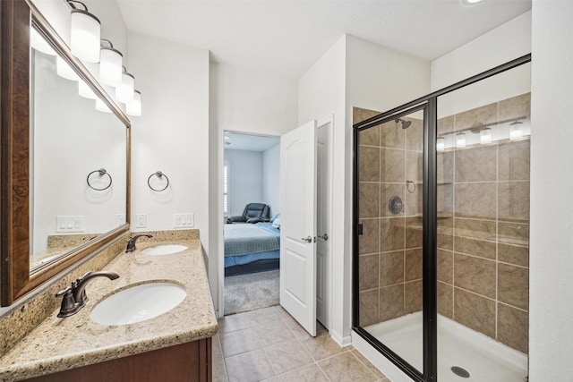 13003 Foxwood Creek Ln, Houston, TX 77044 - ensuite bathroom with a stall shower, tile patterned floors, and double vanity