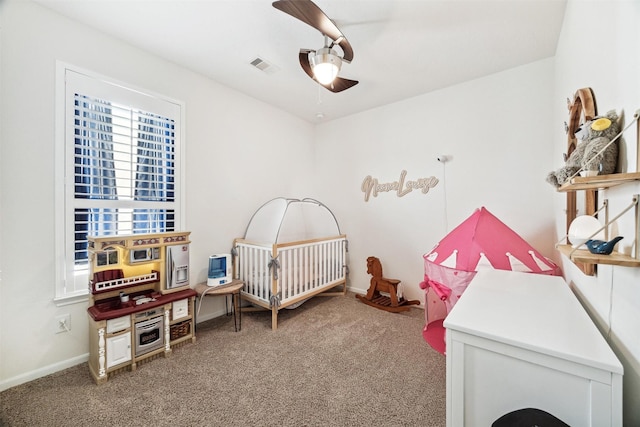 13003 Foxwood Creek Ln, Houston, TX 77044 - bedroom with carpet flooring, a nursery area, baseboards, and ceiling fan