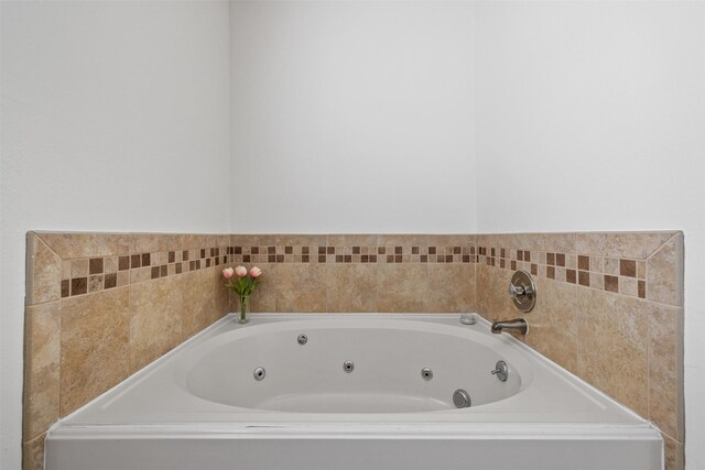 full bath featuring a jetted tub