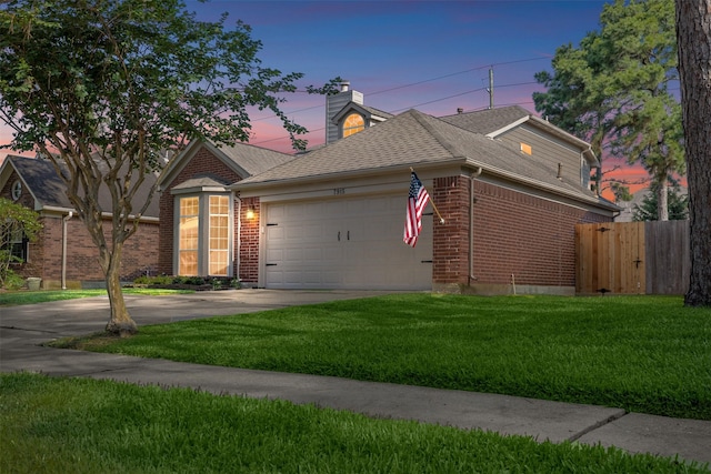 single story home featuring an attached garage, driveway, brick siding, a chimney, and a shingled roof