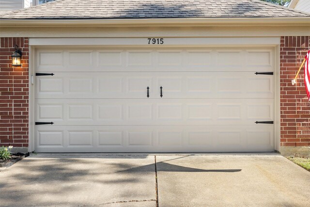 garage with concrete driveway
