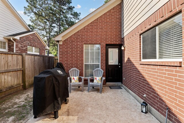 view of patio / terrace featuring fence and grilling area