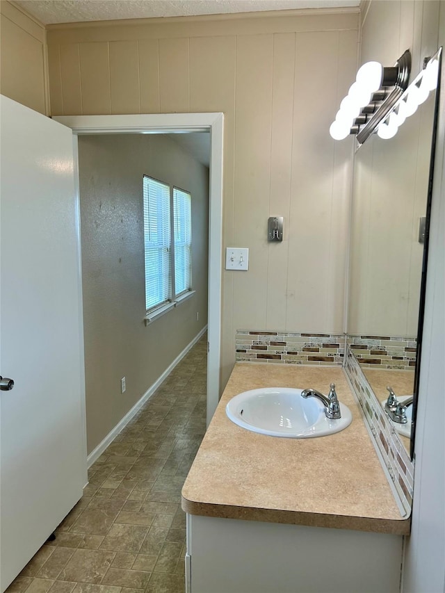 3913 1st, Galveston, TX 77554 - bathroom featuring vanity and baseboards