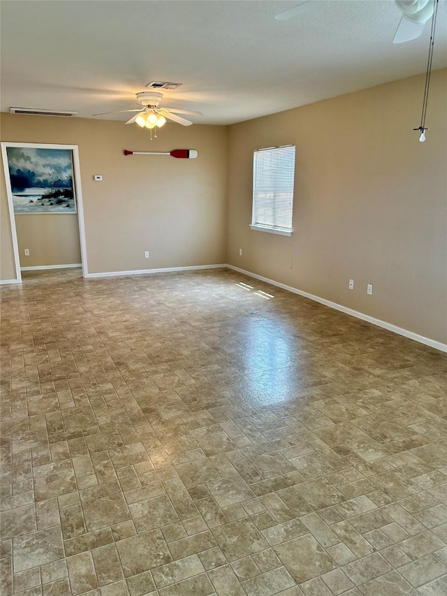 3913 1st, Galveston, TX 77554 - spare room featuring a ceiling fan and baseboards